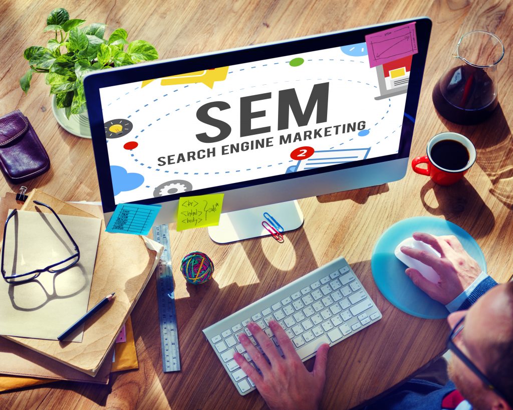photo of monitor with text SEM SEARCH ENGINE MARKETING