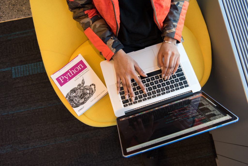 top down view of person editing code of wordpress theme on laptop