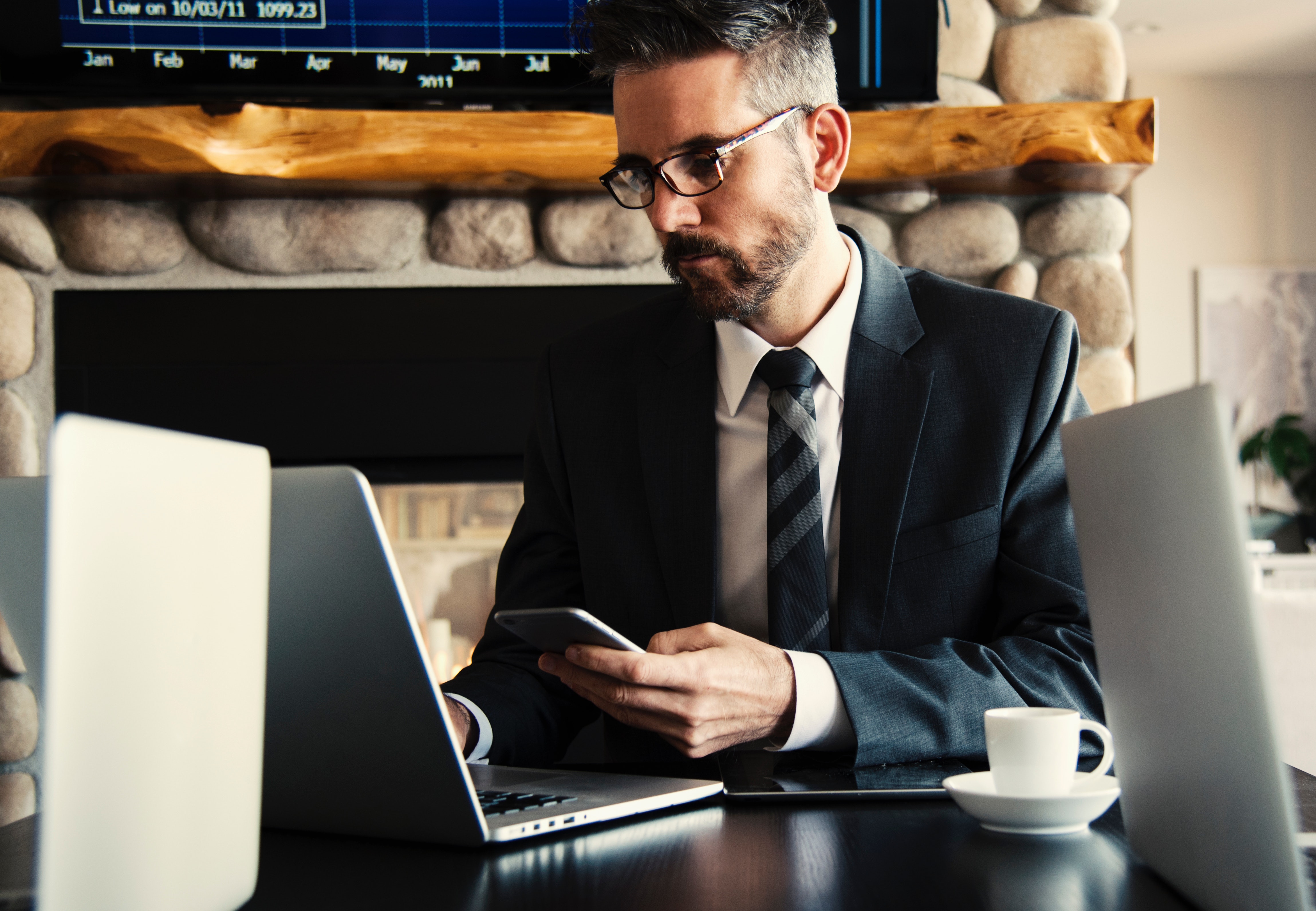 man in suit managing his business website