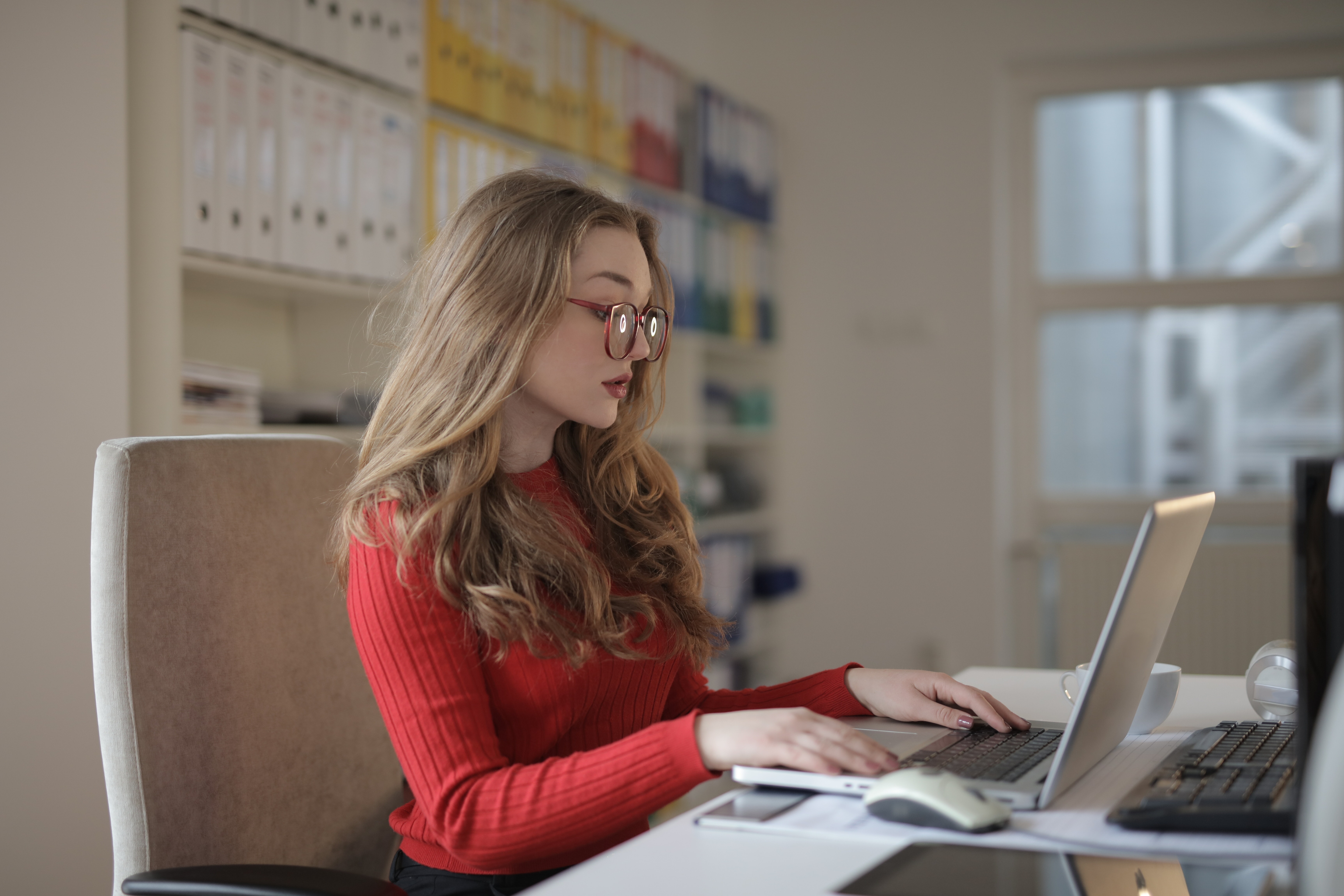 female web developer using laptop checking website health