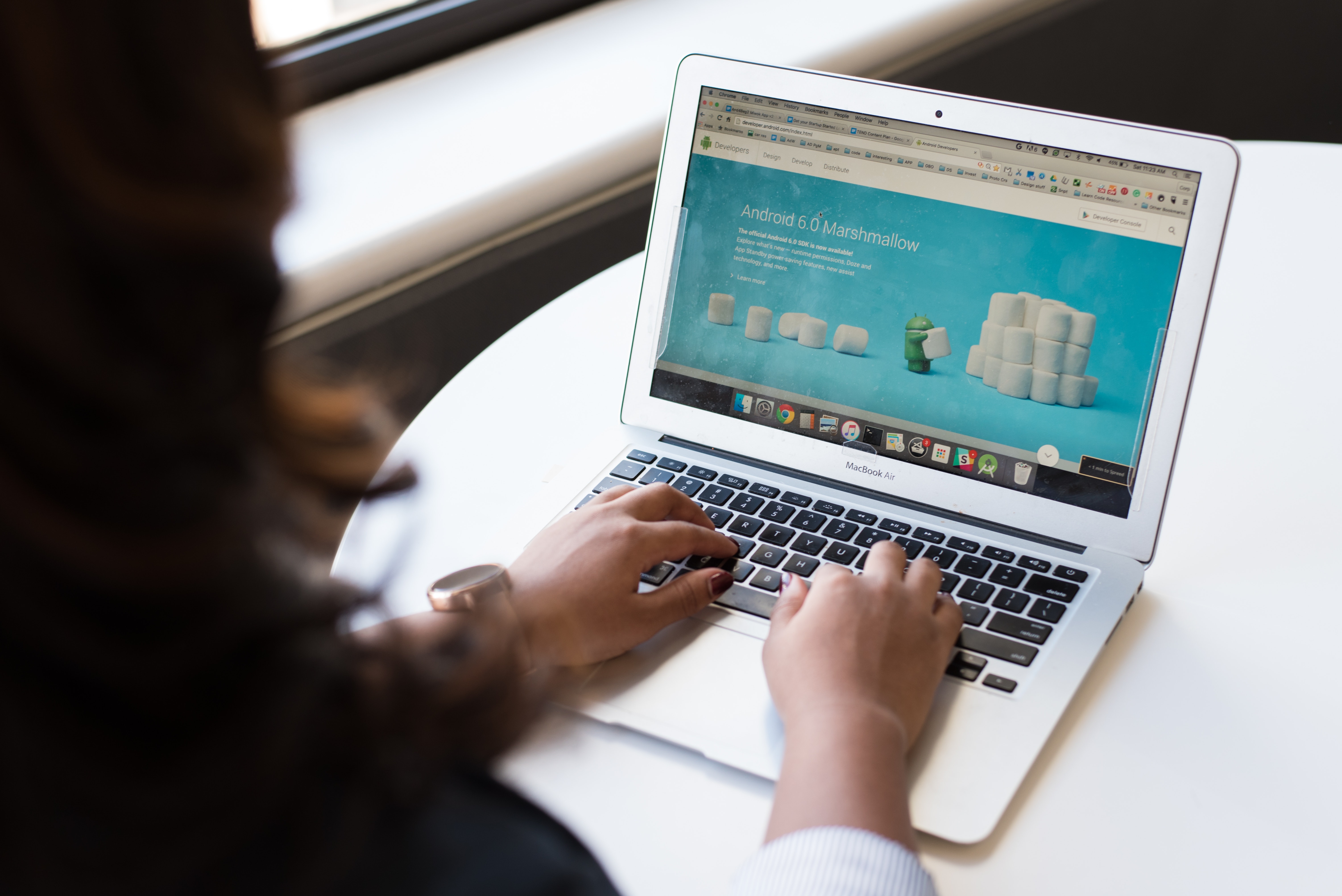 woman using laptop for testing to follow proper web design principles