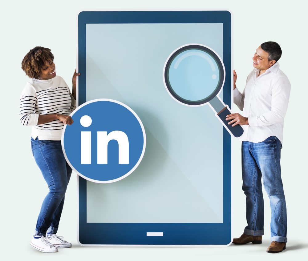 People Holding LinkedIn Icon Tablet